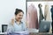 Young asian entrepreneurs are excited about hitting today`s clothing sales target