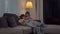 Young Asian family and daughter happy using tablet at home. Korean mother relax with little girl watching movie lying on sofa