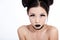 Young asian female with creative black makeup