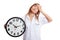 Young Asian female doctor headache with a clock
