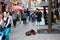 Young Asian female street musician playing violin