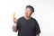 Young Asian funny fat sport man holding banana