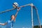 Young asian girl goalkeeper catching the ball