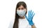 Young asian girl in medical mask and blue gloves pointing on five
