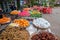 Young Asian girl sells fruit on a city street