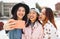 Young Asian girls taking selfie with mobile smartphone outdoor - Happy social friends having fun taking self photos outside