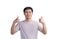 Young Asian handsome man wearing a casual t-shirt standing over white background approving doing positive gestures with his hand,