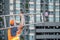 Young Asian maintenance worker carrying aluminium ladder