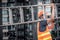 Young Asian maintenance worker carrying aluminium ladder