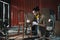 Young Asian man Carpenter uses a tape measure to measure chair on the workbench in woodcraft carpentry workshop.