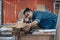 Young Asian man Carpenter uses a tape measure to measure wood on the workbench in woodcraft carpentry workshop.