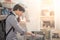 Young Asian man choosing disc in music shop