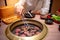 Young Asian man eating Korean Barbecue buffet in restaurant