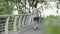 young asian man jogging running exercising outdoors in park