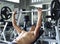 Young asian man lifting barbells in gym. healthy lifestyle and workout motivation concept