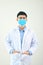 Young asian man in medical field, wearing a white coat and face mask