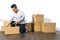 Young asian man moving house Packing cardboard using adhesive