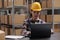 Young asian man warehouse operator managing delivery on laptop