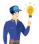 Young asian mechanic pointing at idea light bulb.