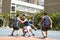 Young asian men playing basketball