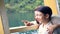 Young asian mother with little son stand on deck of cruise ship