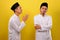 Young Asian Muslim men ignore the apologize of his Muslim`s brother. Bad Attitude in Ramadan