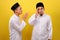 Young Asian Muslim men ignore the apologize of his Muslim`s brother. Bad Attitude in Ramadan