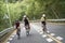 young asian people riding bicycle outdoors