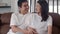 Young Asian Pregnant couple man touch his wife belly talking with his child. Mom and Dad feeling happy smile peaceful while take