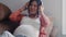 Young Asian Pregnant woman using phone and headphone play music for baby in belly. Mom feeling happy smiling positive and peaceful