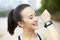 Young asian runner with wearable fitness device