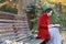 Young asian sensual woman reading a book in romantic autumn scenery.Portrait of pretty young girl in autumnal forest