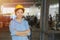 Young Asian smart woman working as foreman head engineer manager at logistic warehouse portrait smiling arms crossed