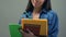 Young Asian student holding books doing homework, foreign exchange, education
