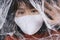 Young asian thai black short hair woman wearing white mask stuck behind plastic wrap cellophane