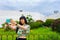 Young Asian tourist woman taking a selfie with a Canarian garden behind.