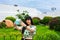 Young Asian tourist woman taking a selfie with a Canarian garden behind.