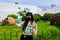 Young Asian tourist woman taking a selfie with a Canarian garden behind.