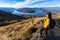 Young asian traveler backpack hiking on Roys peak track, Wanaka, South Island, New Zealand