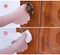 Young Asian woman adult opening door with clean tissue on the knob handle instead of hand, concept of antibacterial, virus