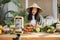 Young asian woman blogger or content creator choping tomatoes preparing vegan salad