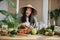 Young asian woman blogger or content creator choping tomatoes preparing vegan salad