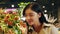 Young asian woman buying flowers