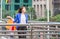 Young Asian woman carrying shopping bags while walking along the street. Shopping concepts