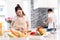 Young asian woman cutting slice vegetables making salad healthy food