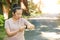 Young Asian woman doing running exercises in the nature park,