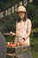 Young asian woman grilling barbeque skewers meat on bbq grill in backyard on picnic time