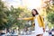 Young Asian woman hailing a taxi ride. Beautiful charming woman hailing a taxi cab in the street. Businesswoman trying to hail a