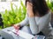 Young asian woman headache while sitting in a cafe garden