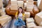 Young Asian woman hold tablet and sit among many boxes or carton and smile to camera with confidence action